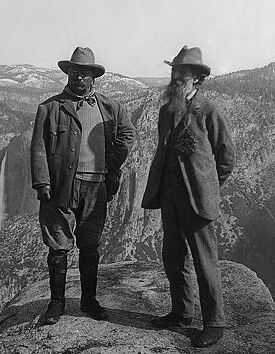 U.S. President Theodore Roosevelt (left) and nature preservationist John Muir, founder of the Sierra Club, on Glacier Point in Yosemite National Park. In the background: Upper and lower Yosemite Falls.